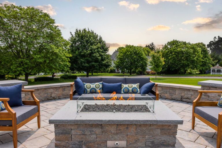 Fire pit, paver patio, and retaining wall with modern design built by Bahler Brothers in Ellington, Connecticut