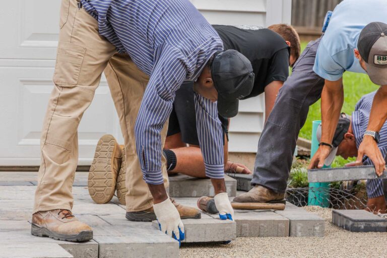 Bahler Brothers crew installing concrete pavers for a driveway during a residential construction project in Newington, Connecticut