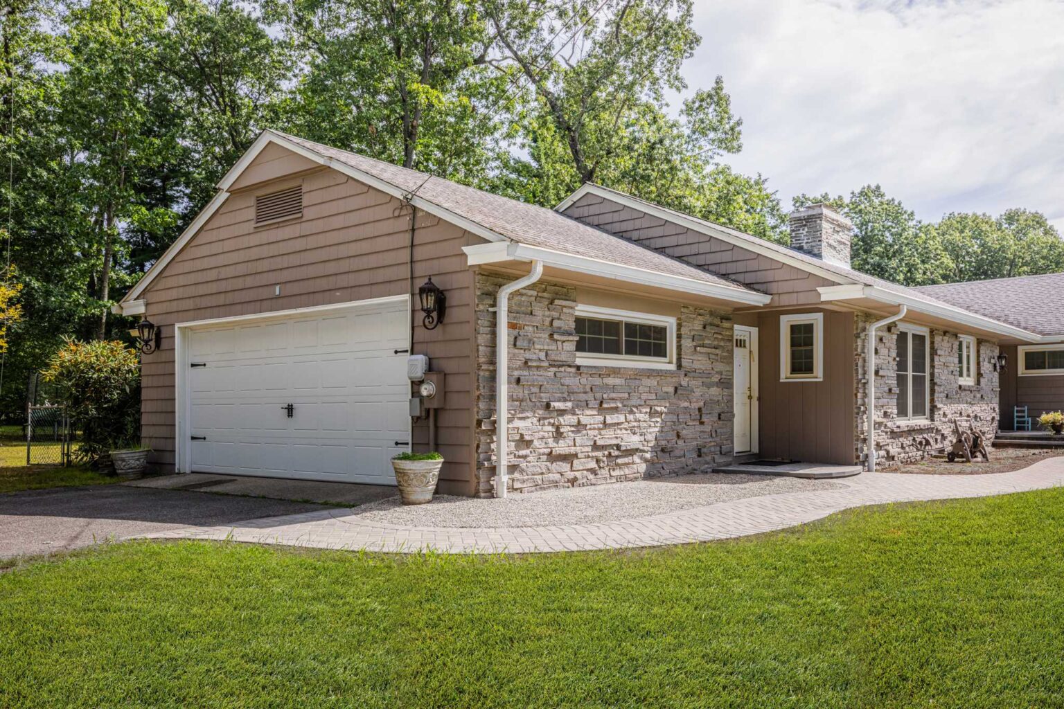 Custom paver walkway attached to driveway built by Bahler Brothers in Springfield, Massachusetts