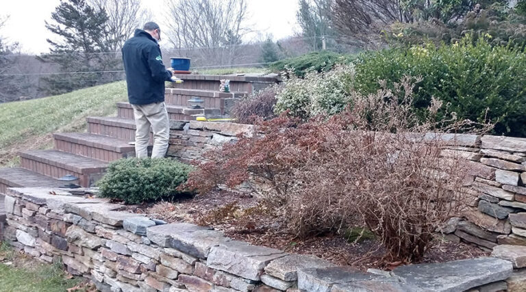Bahler Brothers crew member evaluating a residential site before the start of a project