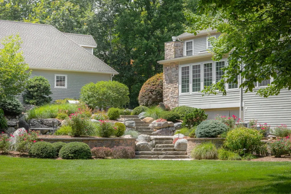 bahler brothers landscape retaining wall with flowers ellington connecticut