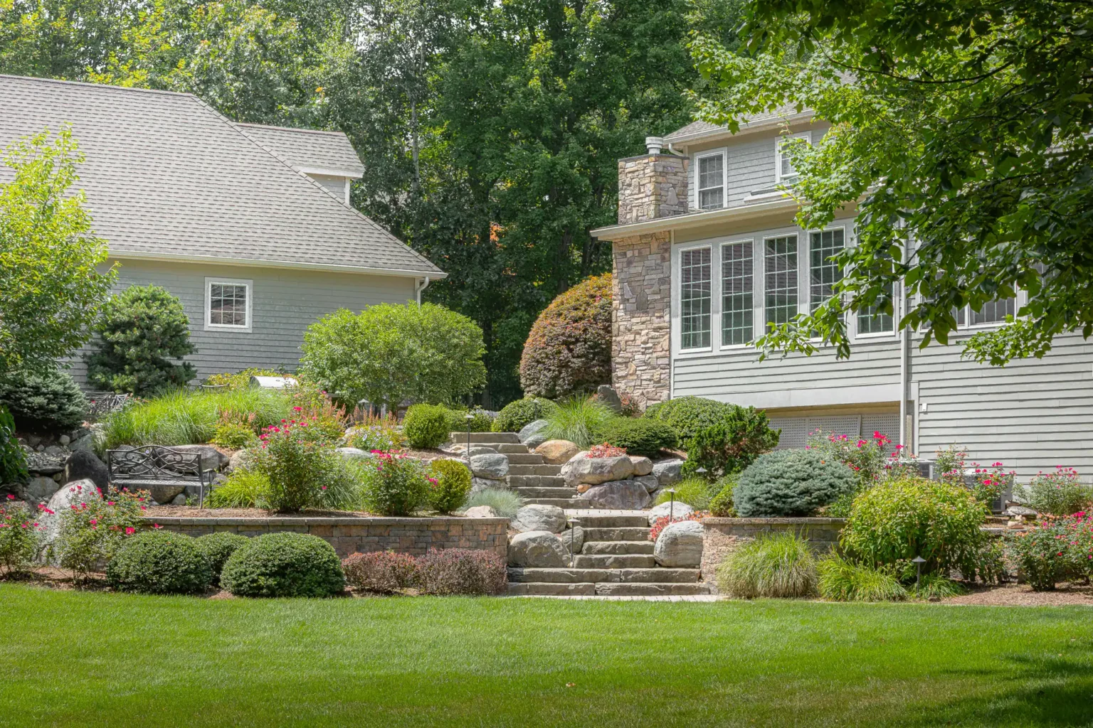 bahler brothers landscape retaining wall with flowers ellington connecticut