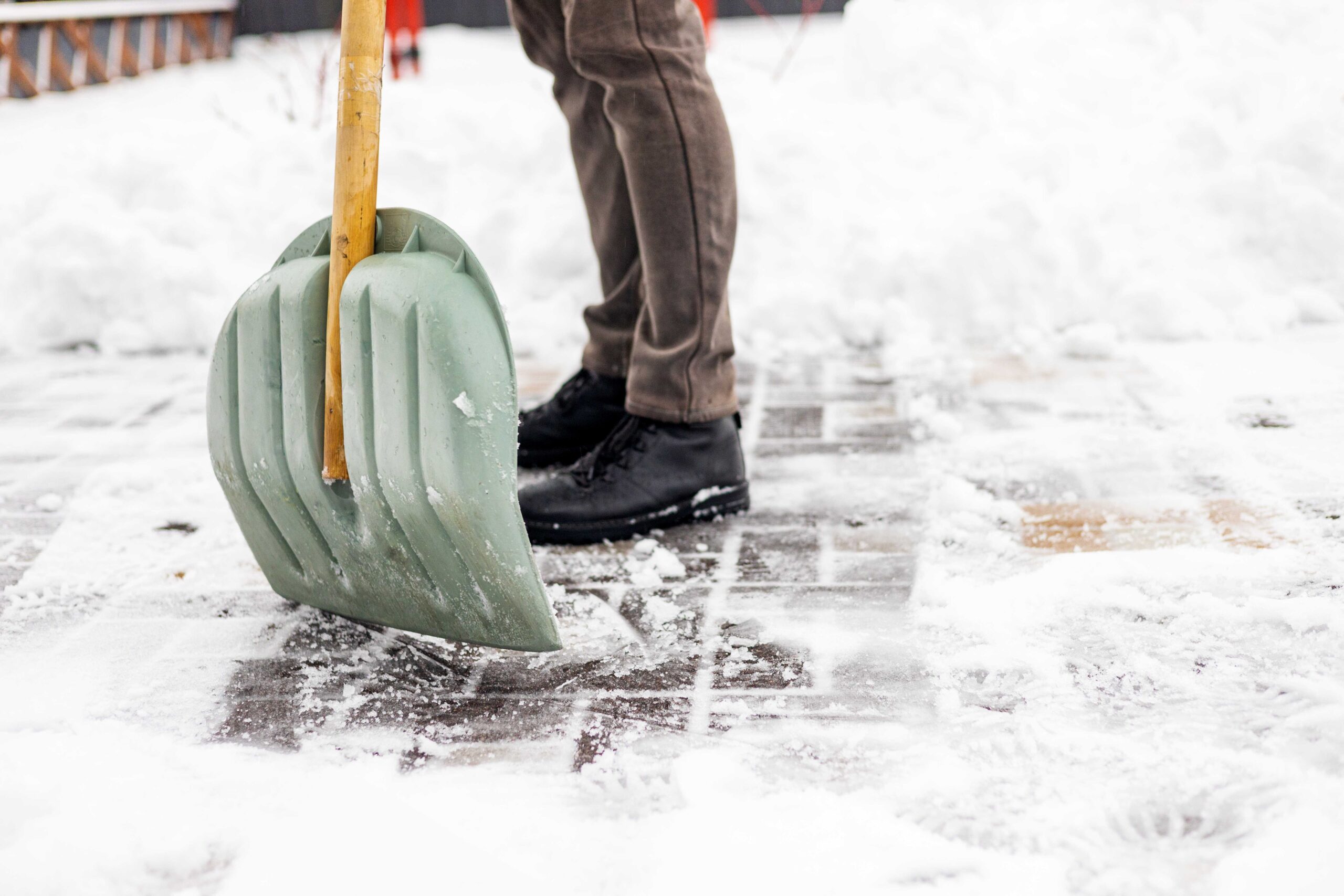 close-up-of-a-man-cleaning-and-clearing-snow