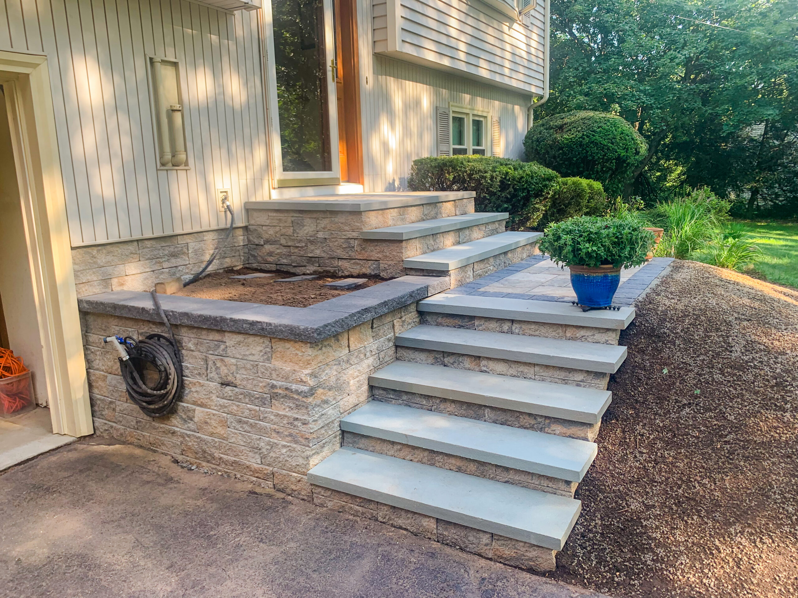 New steps attached to driveway leading up to front entrance