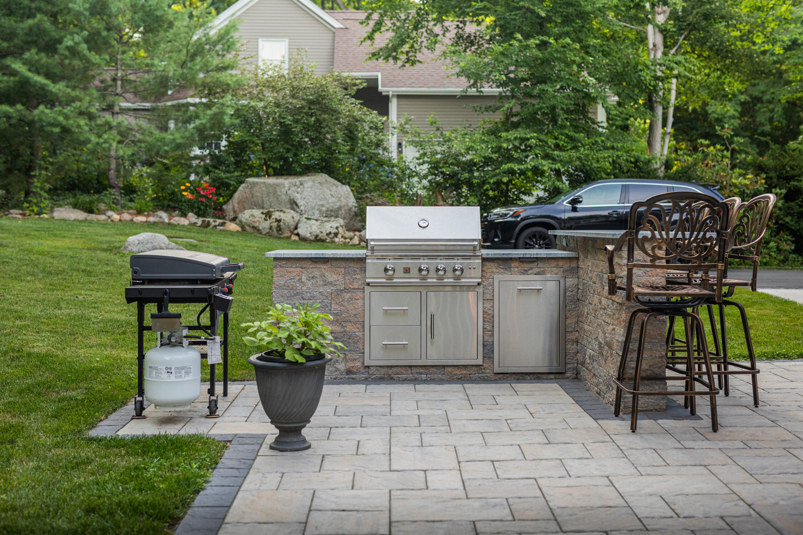 Outdoor kitchen with built-in grill by Bahler Brothers in Glastonbury Connecticut